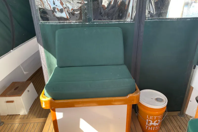 Slide: The Image of Green cushioned seat on 1996 Downeast 36 Lobster Boat deck, with orange bucket nearby. - 11