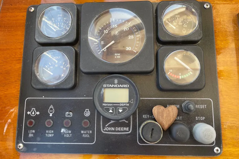 Slide: The Image of Instrument panel of a 1996 Downeast 36 Lobster Boat with gauges and controls. - 17