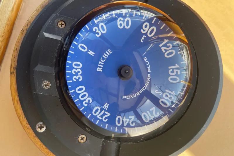 Slide: The Image of Compass on 1996 Downeast 36 Lobster Boat, displaying cardinal directions. - 20
