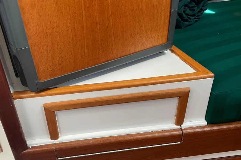 Slide: The Image of Interior detail of 1996 Downeast 36 Lobster Boat with wood paneling and green upholstery. - 28