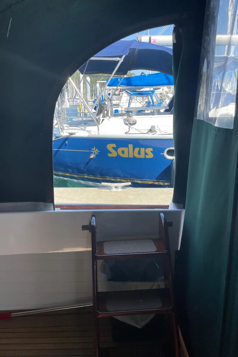 Slide: The Image of 1996 Downeast 36 Lobster Boat interior with view of blue boat "Salus" outside. - 35