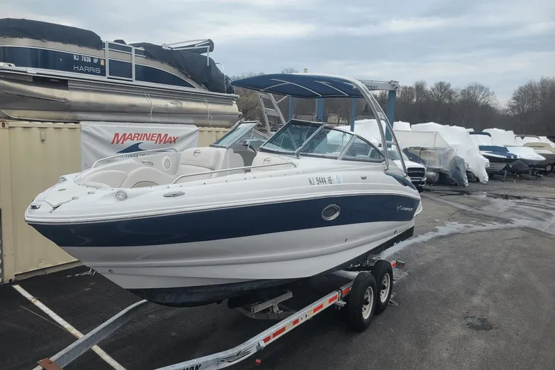 Slide: The Image of 2012 Crownline 265 SS boat on trailer at MarineMax dealership. - 1