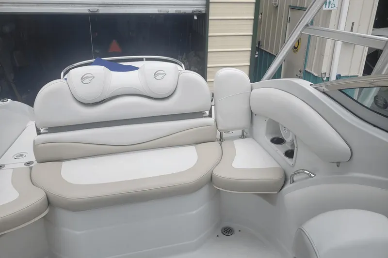 Slide: The Image of Interior seating of a 2012 Crownline 265 SS boat with white and beige upholstery. - 10