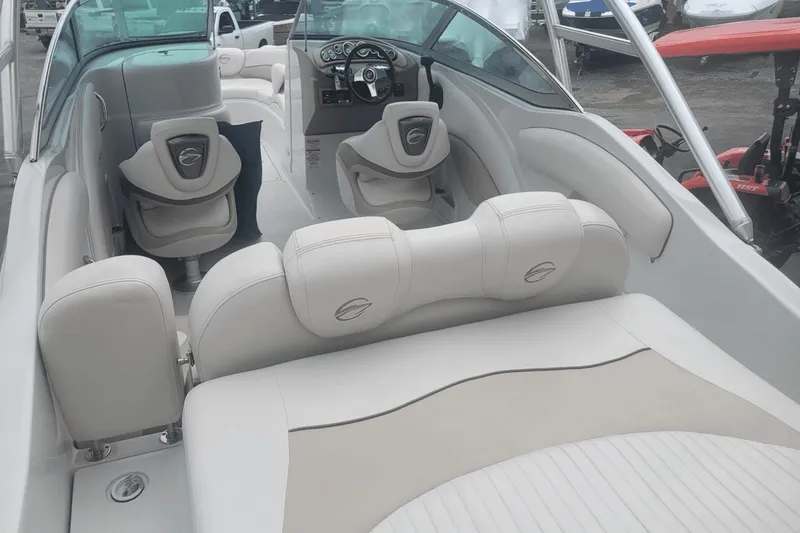 Slide: The Image of Interior of a 2012 Crownline 265 SS boat with white leather seating. - 11