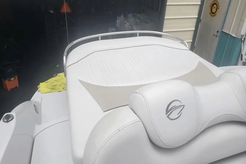 Slide: The Image of 2012 Crownline 265 SS boat with white leather seating in a storage area. - 12