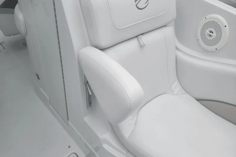 Slide: The Image of White leather seat in a 2012 Crownline 265 SS boat with built-in speaker. - 13