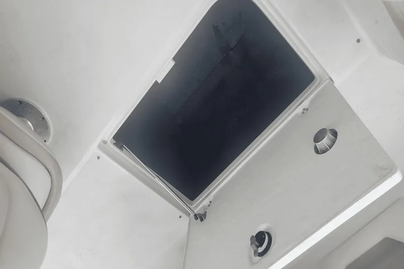Slide: The Image of Interior hatch of a 2012 Crownline 265 SS boat. - 22
