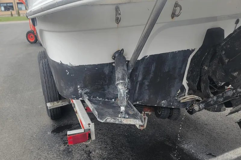Slide: The Image of Rear view of a 2012 Crownline 265 SS boat on a trailer. - 27