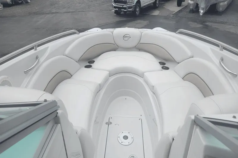 Slide: The Image of 2012 Crownline 265 SS boat with spacious white seating area. - 8