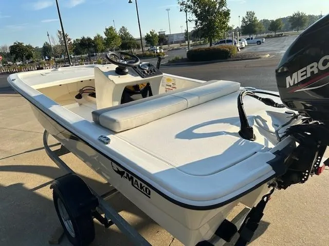 Slide: The Image of 2023 Mako Pro Skiff 13 CC boat with Mercury engine on trailer. - 4