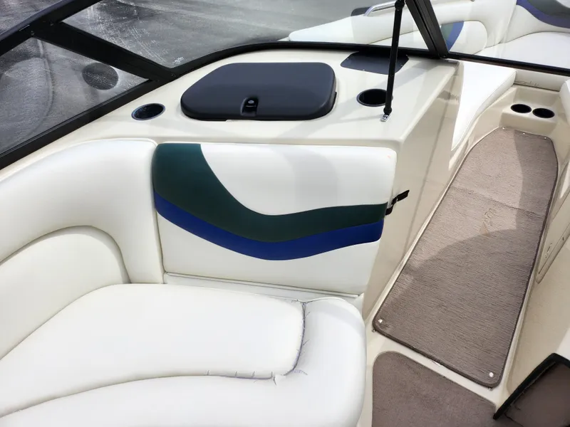 Slide: The Image of 1998 Tigé PRE 2200I boat interior with white and blue seating. - 10