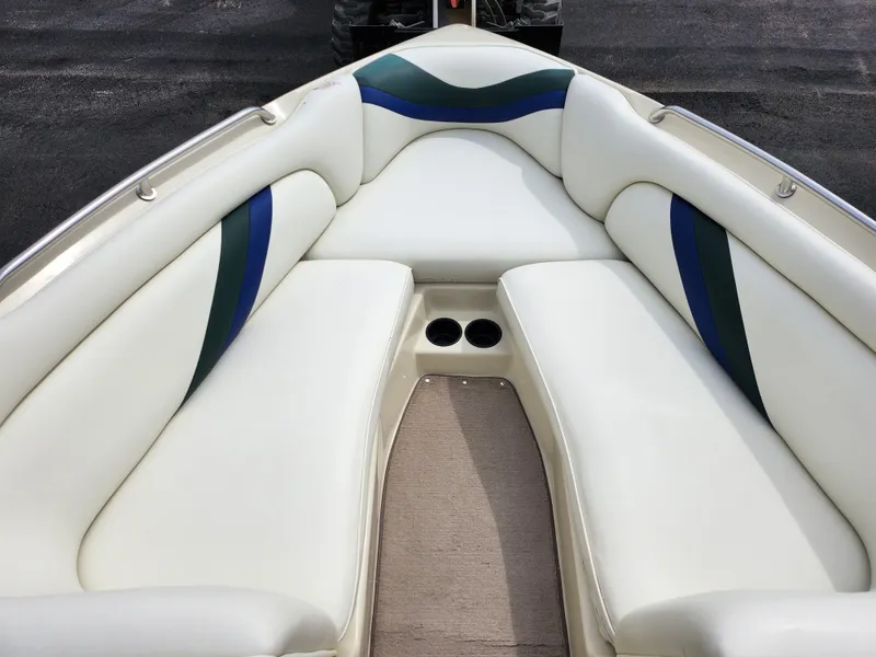 Slide: The Image of 1998 Tigé PRE 2200I boat interior with white and blue cushioned seating. - 13