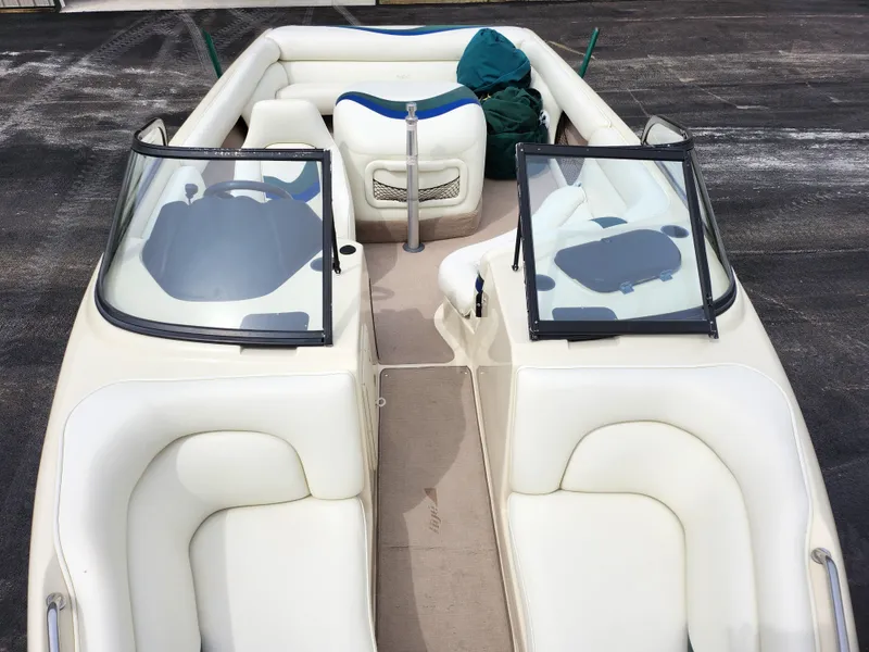 Slide: The Image of 1998 Tigé PRE 2200I boat interior with white seating and open windshield. - 15