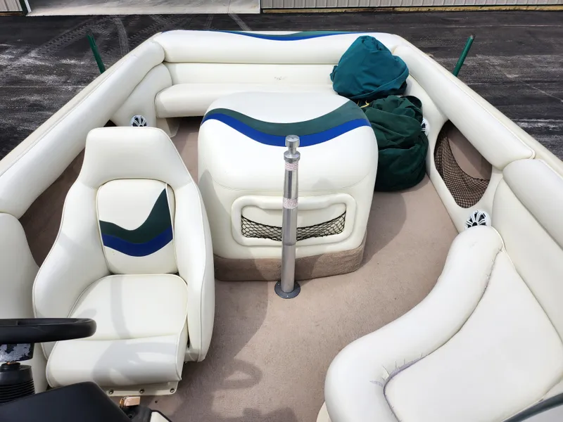 Slide: The Image of 1998 Tigé PRE 2200I boat interior with white and blue seating. - 16