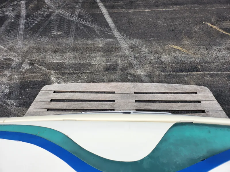 Slide: The Image of 1998 Tigé PRE 2200I boat rear view with swim platform. - 19