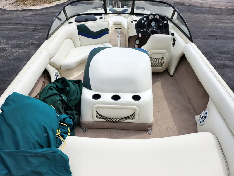 Slide: The Image of 1998 Tigé PRE 2200I boat interior with white and green upholstery. - 7