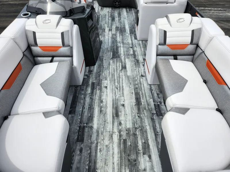 Slide: The Image of 2019 Crest Caliber 230 SL boat interior with white and gray seating. - 10