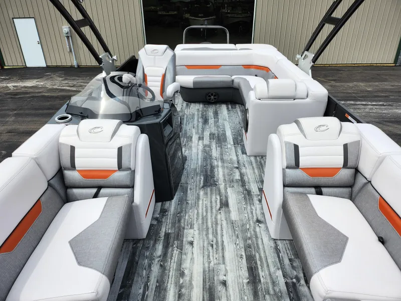 Slide: The Image of 2019 Crest Caliber 230 SL pontoon boat interior with modern seating and sleek design. - 11
