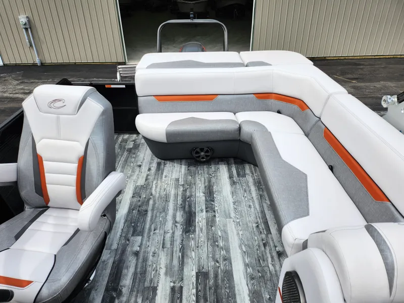 Slide: The Image of 2019 Crest Caliber 230 SL boat interior with white and gray seating. - 14