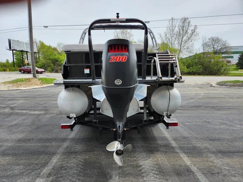 Slide: The Image of 2019 Crest Caliber 230 SL pontoon boat rear view with 200 HP outboard motor. - 2