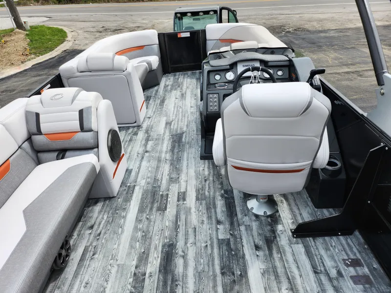 Slide: The Image of 2019 Crest Caliber 230 SL pontoon boat interior with modern seating and control console. - 20