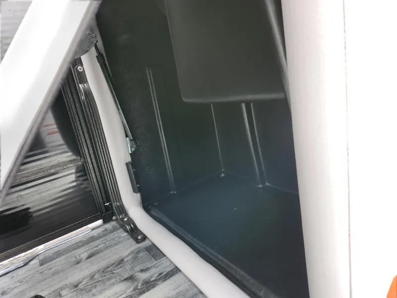 Slide: The Image of 2019 Crest Caliber 230 SL storage compartment interior. - 24