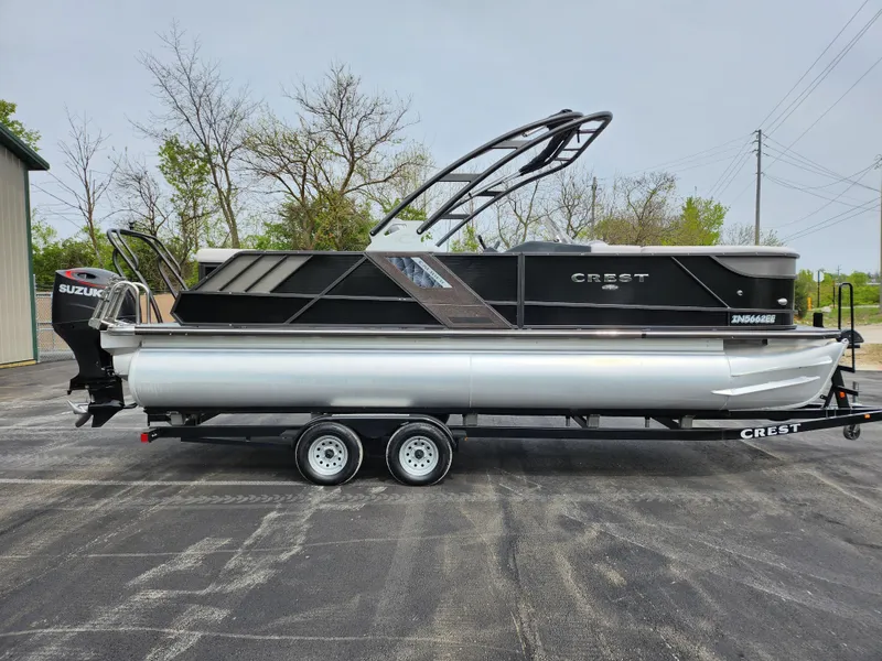 Slide: The Image of 2019 Crest Caliber 230 SL pontoon boat on a trailer, side view. - 4