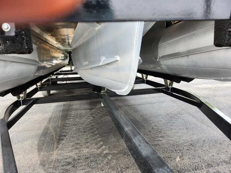 Slide: The Image of Underneath view of a 2019 Crest Caliber 230 SL pontoon boat on a trailer. - 7