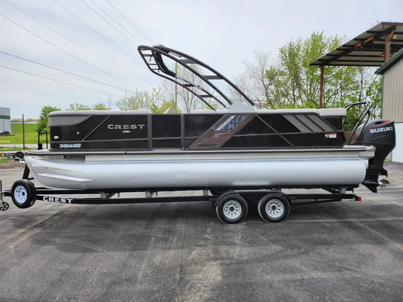 Slide: The Image of 2019 Crest Caliber 230 SL pontoon boat on a trailer. - 9