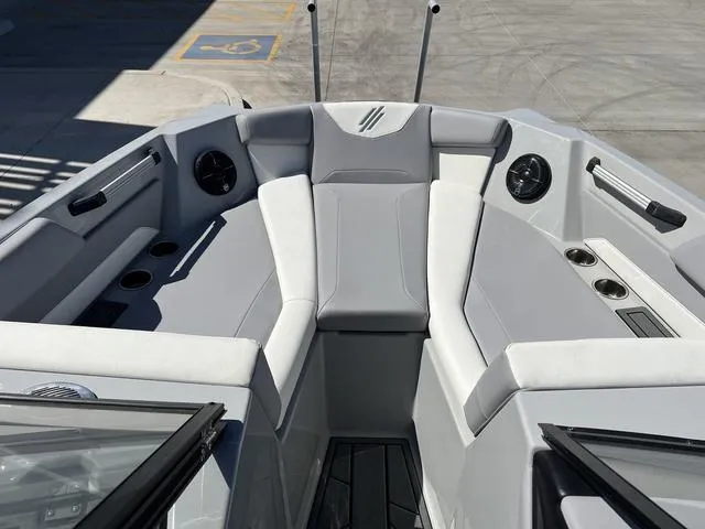 Slide: The Image of 2023 ATX Boats 22 TYPE-S interior with gray seating and cup holders. - 12