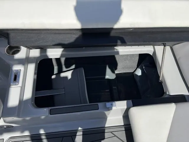 Slide: The Image of 2023 ATX Boats 22 TYPE-S storage compartment with open lid, showcasing interior space. - 15