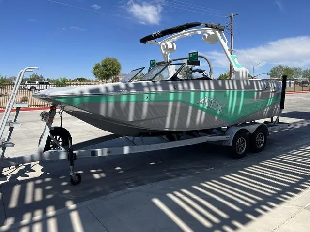 Slide: The Image of 2023 ATX Boats 22 TYPE-S on trailer, parked outdoors under clear blue sky. - 7