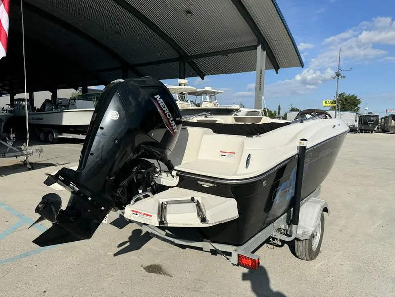 Slide: The Image of 2022 Bayliner Element E18 boat with Mercury outboard motor on trailer. - 4