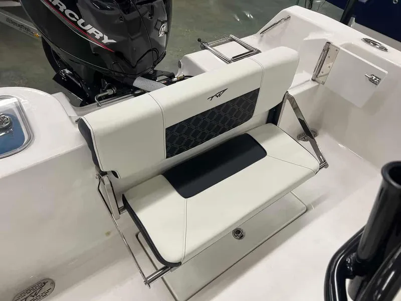 Slide: The Image of 2023 Tidewater 210 Adventure boat with Mercury engine and foldable rear seat. - 11