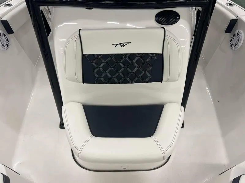 Slide: The Image of 2023 Tidewater 210 Adventure boat seat with black and white upholstery. - 7