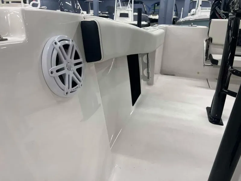 Slide: The Image of 2023 Tidewater 210 Adventure boat interior with speaker and seating. - 8