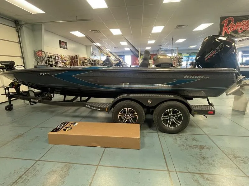 The Image of 2023 Triton 21 XrT boat on display in showroom. - 1