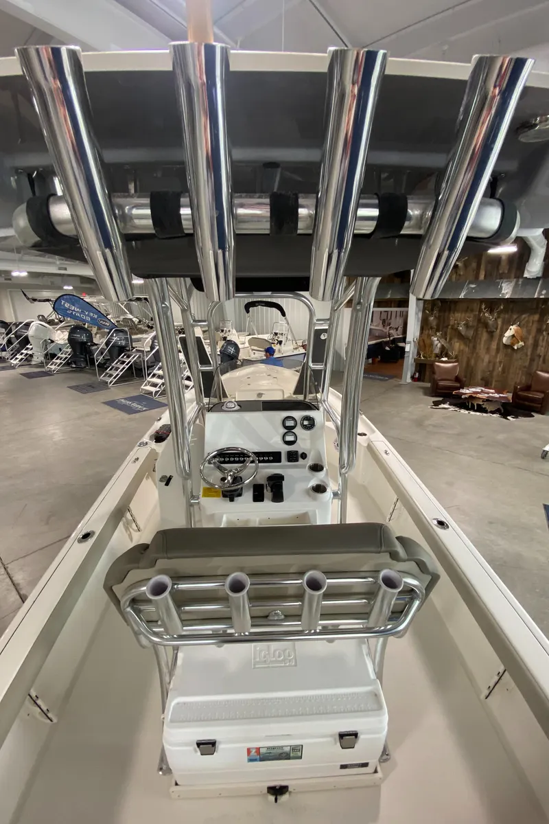 Slide: The Image of 2024 Key West 250 Bay Reef center console boat interior with rod holders. - 16