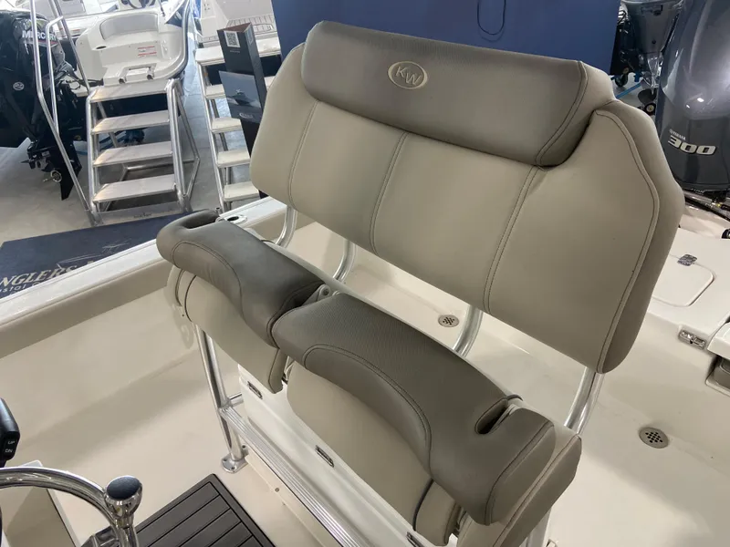 Slide: The Image of 2024 Key West 250 Bay Reef boat seating and helm area. - 11