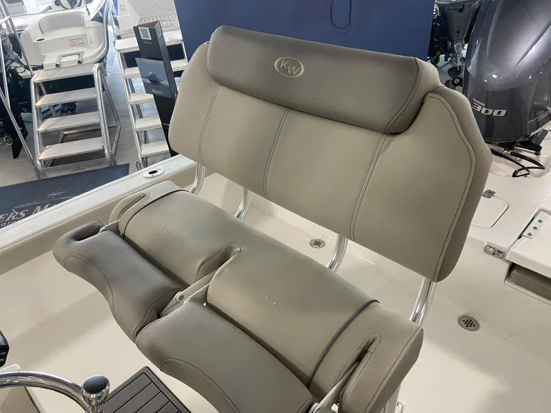 Slide: The Image of 2024 Key West 250 Bay Reef boat seating with cushioned backrest. - 12