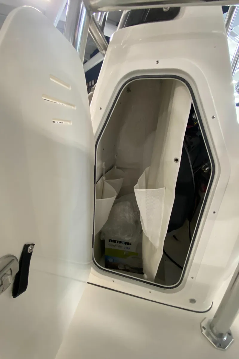 Slide: The Image of 2024 Key West 250 Bay Reef storage compartment. - 24