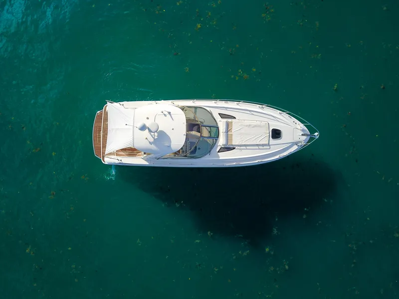 Slide: The Image of Aerial view of 2009 Sea Ray 350 Sundancer yacht on clear blue water. - 12