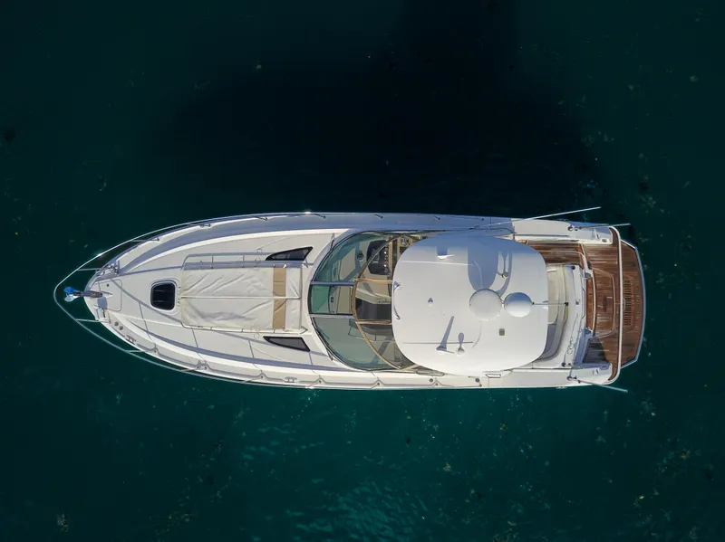 Slide: The Image of Aerial view of a 2009 Sea Ray 350 Sundancer yacht on clear blue water. - 13
