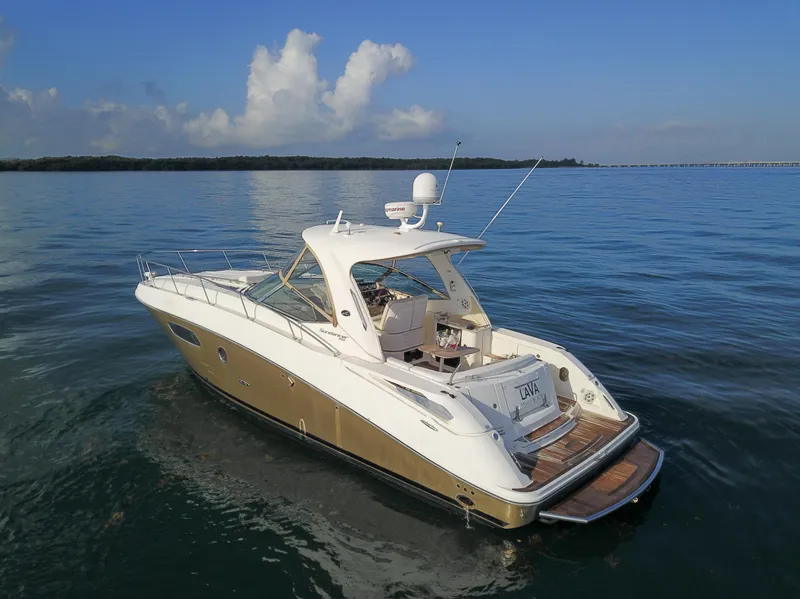 Slide: The Image of 2009 Sea Ray 350 Sundancer yacht on calm waters. - 14