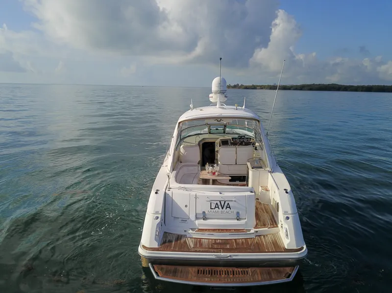 Slide: The Image of 2009 Sea Ray 350 Sundancer boat on calm waters under a cloudy sky. - 15