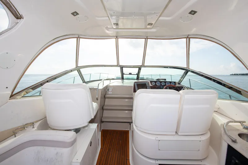 Slide: The Image of Interior cockpit of 2009 Sea Ray 350 Sundancer yacht with ocean view. - 17