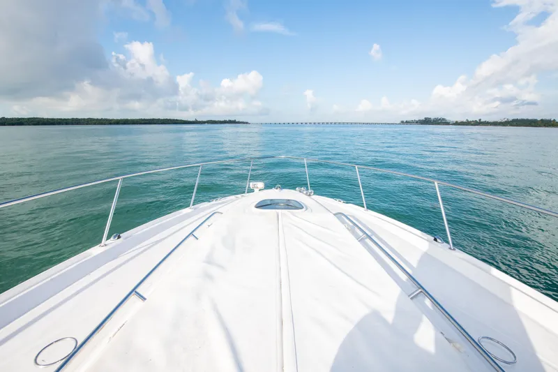 Slide: The Image of Bow view of 2009 Sea Ray 350 Sundancer cruising on calm waters. - 32