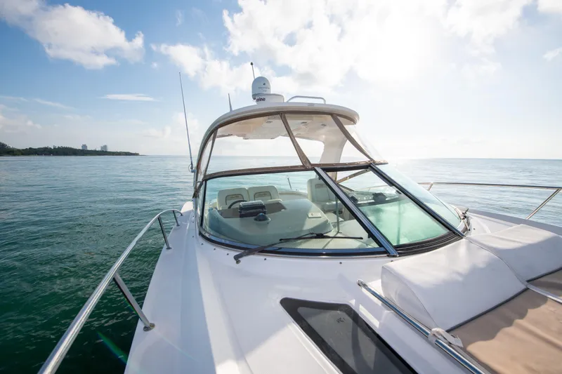 Slide: The Image of 2009 Sea Ray 350 Sundancer yacht cruising on open water. - 34