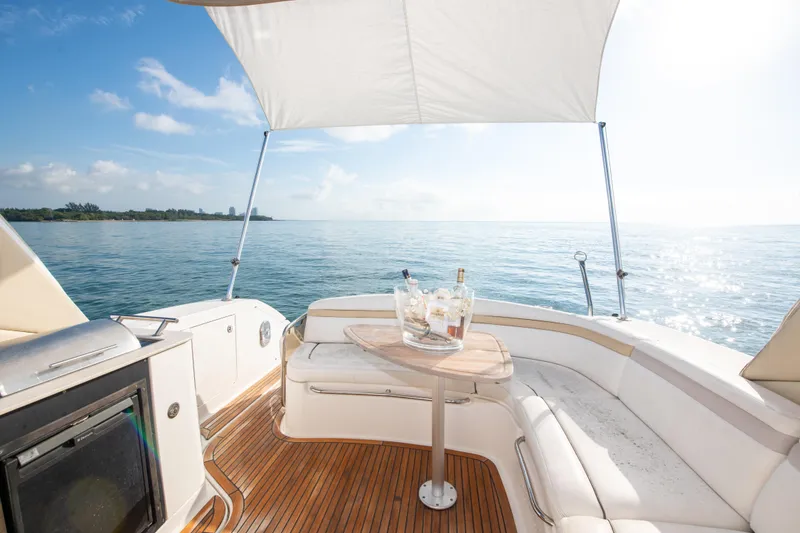 Slide: The Image of Luxury 2009 Sea Ray 350 Sundancer yacht with shaded deck, ocean view, and seating area. - 39