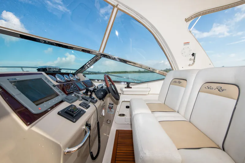 Slide: The Image of 2009 Sea Ray 350 Sundancer helm with modern controls and comfortable seating. - 40